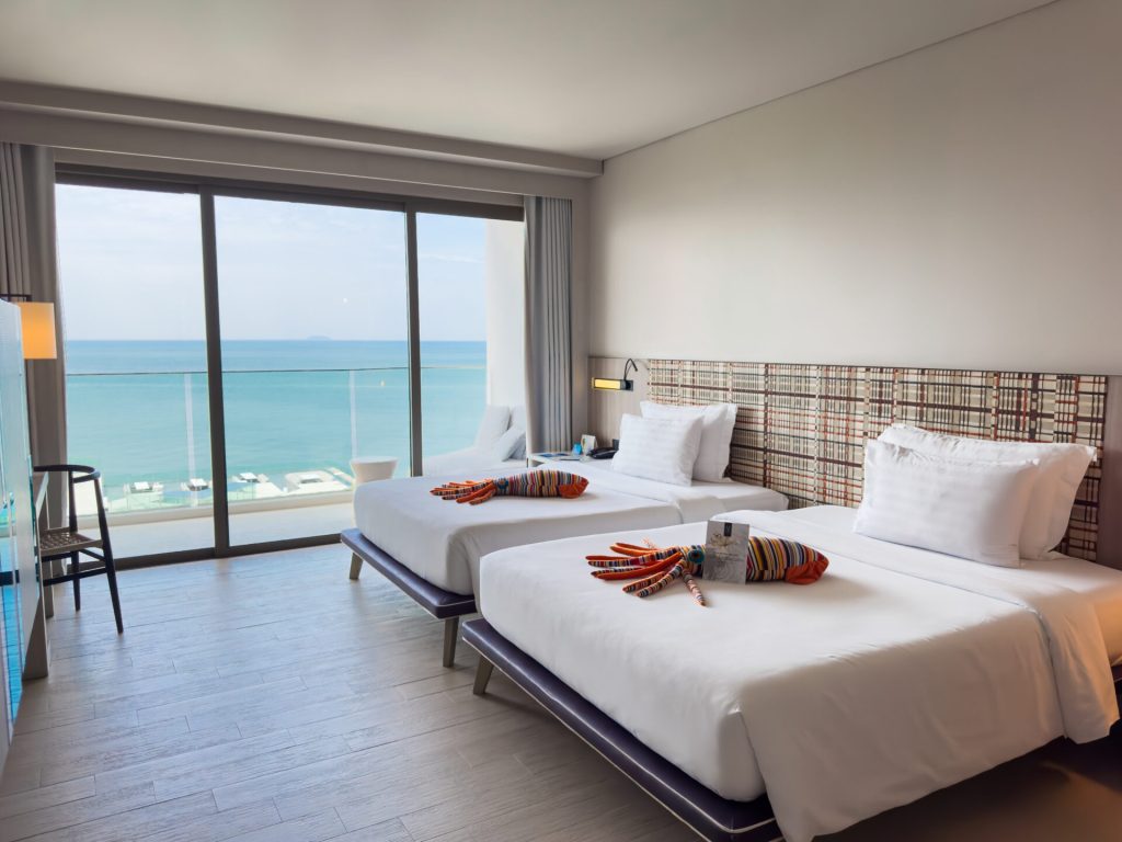 Relax in a Coastal-Inspired Room Blending Comfort and Modern Charm.